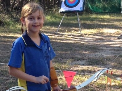 Alana Green trying archery at Kindilan Girl Guide camp. Picture: Kerrie Green.