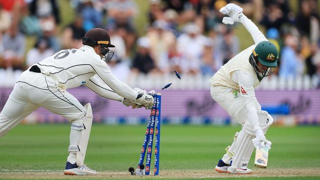 Australia's Usman Khawaja (R) is stumped by New Zealand's wicketkeeper Tom Blundell. Picture: AFP.