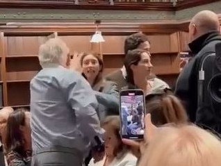 One elderly gentleman waved his hand in the face of one of the protesters.