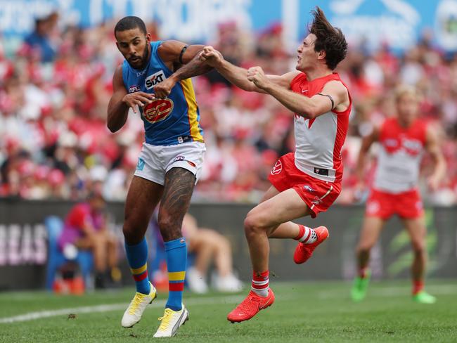 Touk Miller of the Suns bumps Errol Gulden of the Swans at the SCG. Picture: Mark Metcalfe/AFL Photos/via Getty Images.