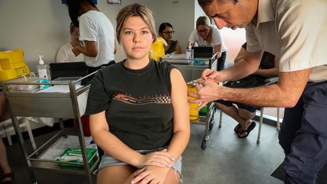 Next Practice GP Sean Stevens gives the COVID-19 vaccine to frontline healthcare worker Elle Lockayne, 22, at his surgery in Perth’s East Victoria Park. Picture: Colin Murty