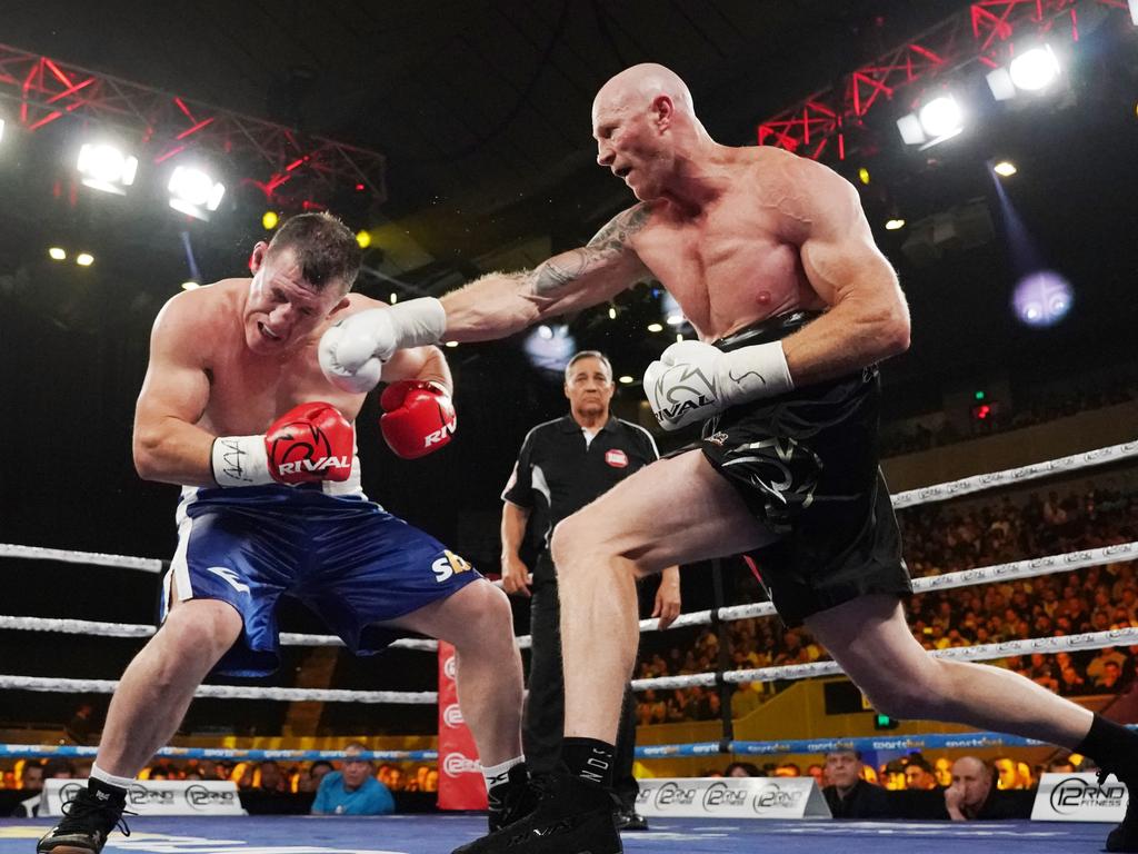 Paul Gallen and Barry Hall slog it out.