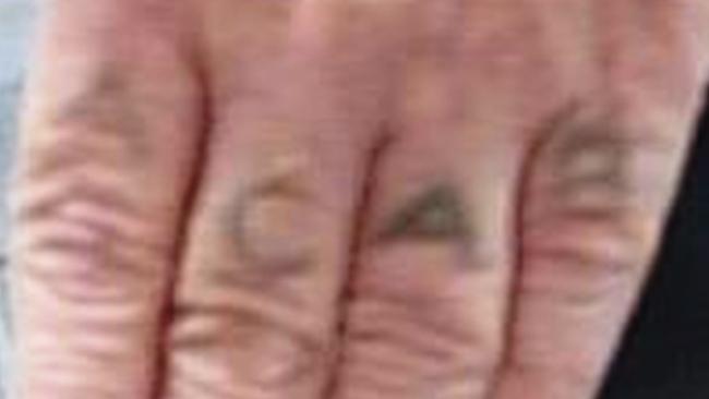 The tattoo on the hand of James Kinch — ACAB . (All Cops Are Bastards). Picture: Supplied