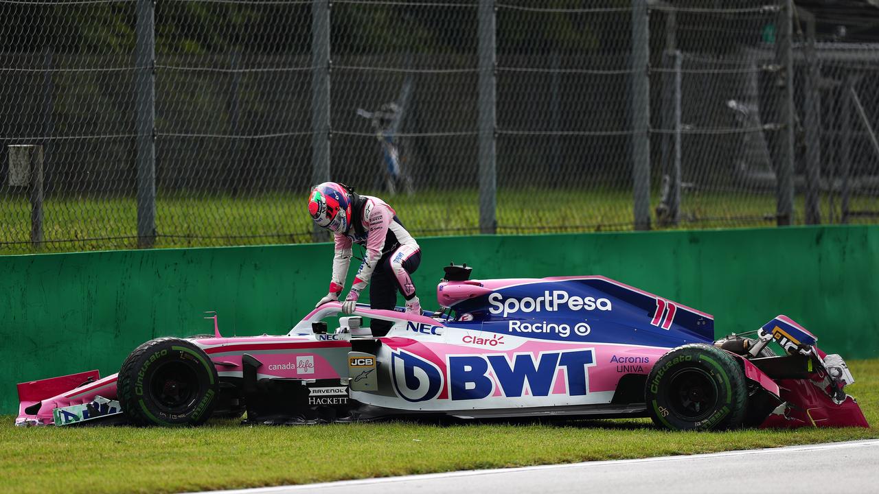 Sergio Perez climbs from his car after crashing during practice at Monza.