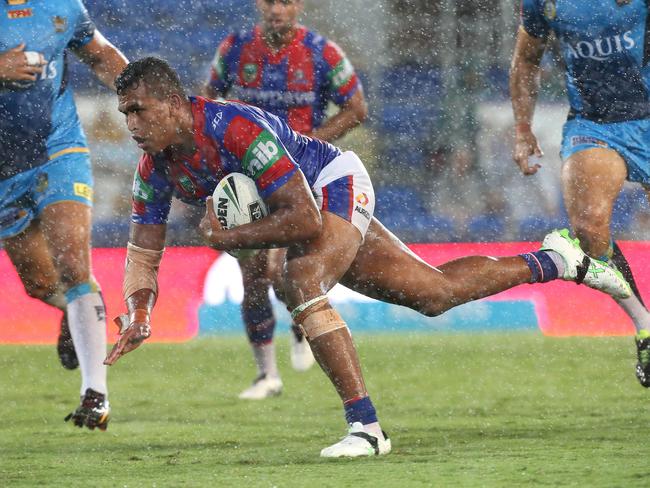 Daniel Saifiti scores a try during his dazzling debut. Picture: Adam Head