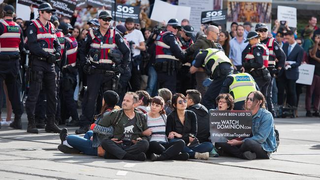 Animal rights protesters shut down a major Melbourne CBD intersection on Monday. Picture: AAP/Ellen Smith