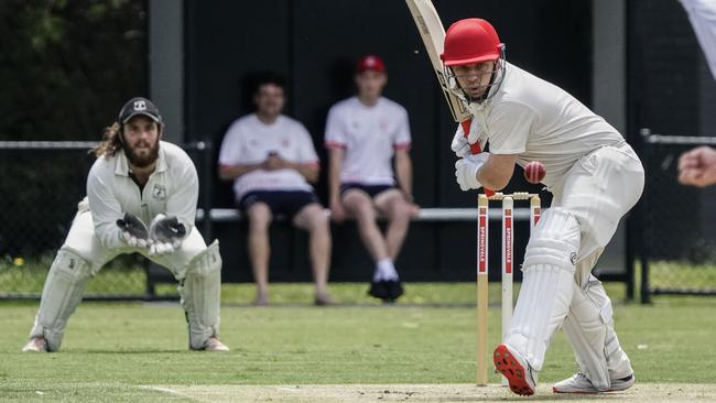 DDCA: Narre Warren wicketkeeper Ben Swift and Springvale South batsman Paul Hill watch the ball. Picture: Valeriu Campan