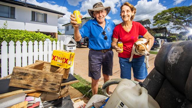 A free carton of XXXX Gold has brought a smile to Brisbane cyclone victims Donald and Rosyln Smith. Picture: Nigel Hallett