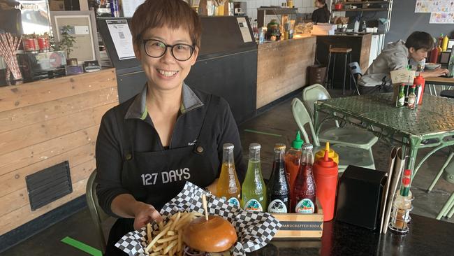 127 days owner Jackie Au with one of the best burgers out west. Picture: Paula Thompson