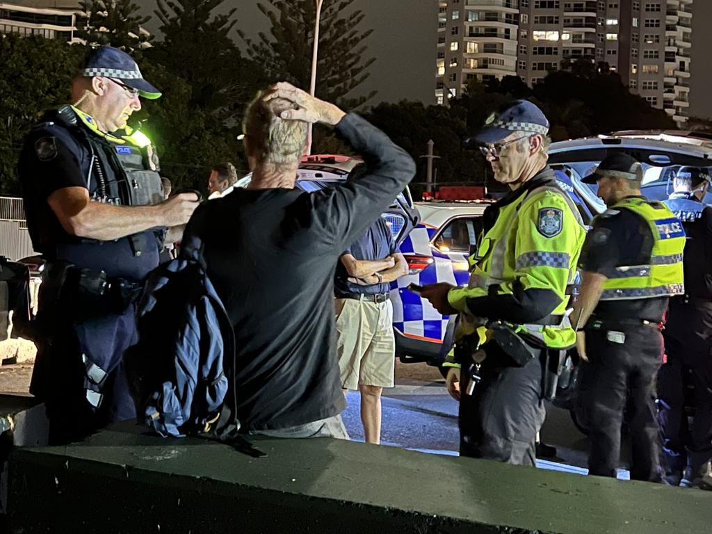 A man is spoken to by police. Picture: Keith Woods.