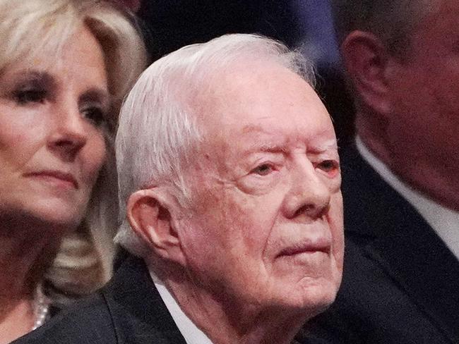 (FILES) In this file photo taken on December 5, 2018 former US president Jimmy Carter attends the funeral service for former US president George H. W. Bush at the National Cathedral in Washington, DC on December 5, 2018. - Carter, the 98-year-old former US president who led the nation from 1977 to 1981, is receiving hospice care at home where he will spend his "remaining time," his nonprofit foundation said on February 18, 2023. After a series of short hospital stays, former US President Jimmy Carter today decided to spend his remaining time at home with his family and receive hospice care instead of additional medical intervention," the Carter Center said in a statement posted to Twitter. (Photo by MANDEL NGAN / AFP)