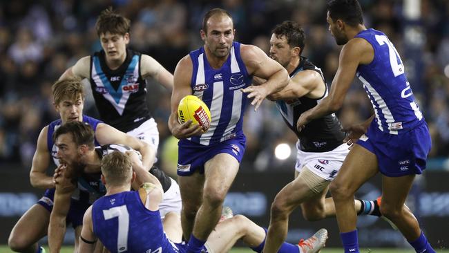 Ben Cunnington breaks away from Port Adelaide’s Travis Boak in Round 22. Picture: Daniel Pockett/AAP