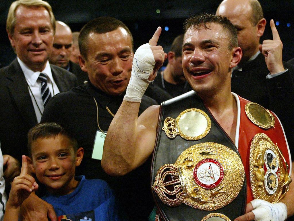 Kostya celebrates his win with son Tim. Picture: Digital Image.