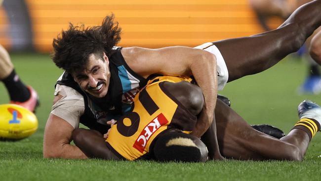 NCA. ADELAIDE, AUSTRALIA. September 13, 2024. AFL Semi Finals. Hawthorn vs Port Adelaide at the Adelaide Oval. Hawthorns Mabior Chol is tackled by Ports  Lachie Jones in the second quarter. Picture: Michael Klein