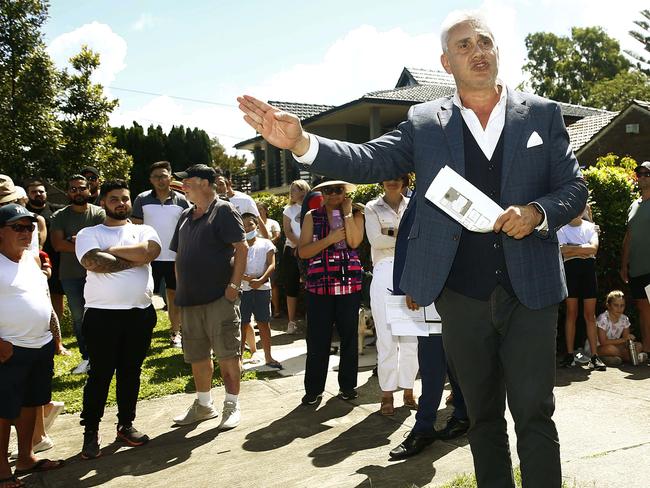 Tom Panos in his role as auctioneer presides over an Auction at 4 Curtin Avenue, Abbotsford. Picture: John Appleyard