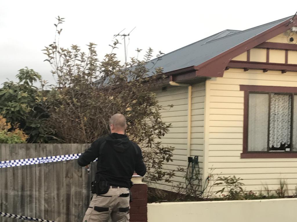 Tasmania Police on Main Street in Ulverstone where Ms Marshall was found dead. Photo: Helen Kempton