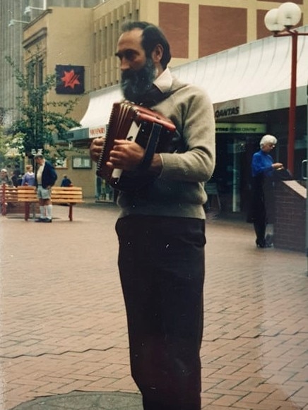 Geoffrey Rallings busking in the Elizabeth Street mall. Picture: Supplied by Irene Rallings