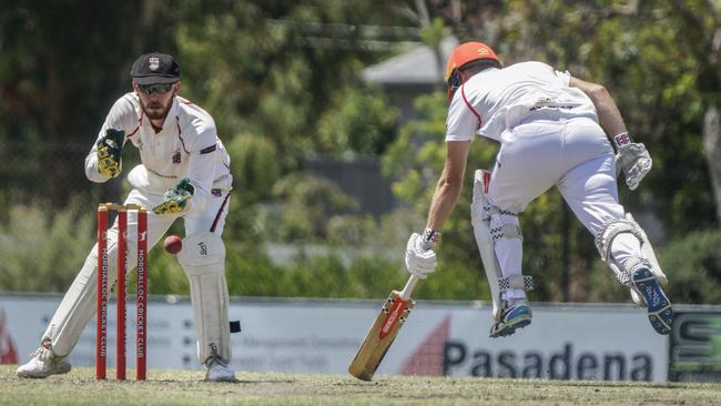 CSB: South Caulfield keeper Elliott Bradley can’t stop Mordialloc batter Ryan Morris. Picture: Valeriu Campan