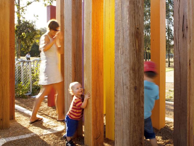 Family playing at Plough and Harrow in the Western Sydney Parklands.