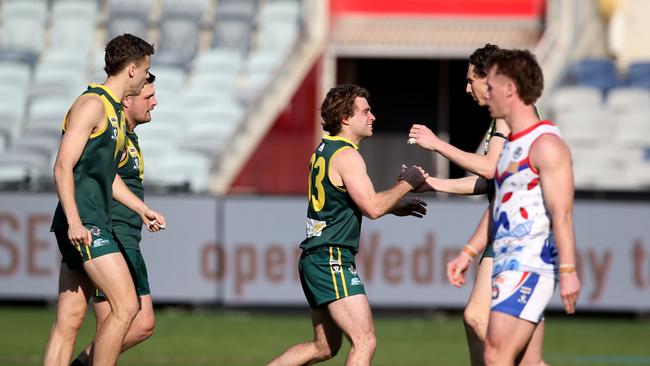 James Edmonds (middle) celebrats one of his two goals. Picture: Mike Dugdale