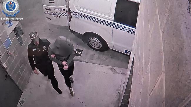 Police arrest one of the six men. Picture: NSW Police