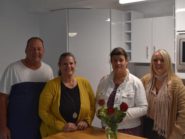 Rex, Linda and daughter Allyce Cunningham with Fiona Moseley in the kitchen of their new unit complex.