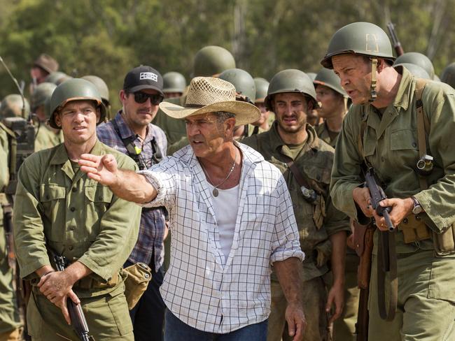 Director Mel Gibson, centre, and actor Vince Vaughn on the set of the film Hacksaw Ridge. Picture: Summit via AP