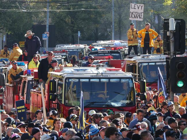 Farmers, firefighters, industry, councils and homeowners protested the Allan government’s $5.14 billion tax grab outside parliament. Picture: David Caird