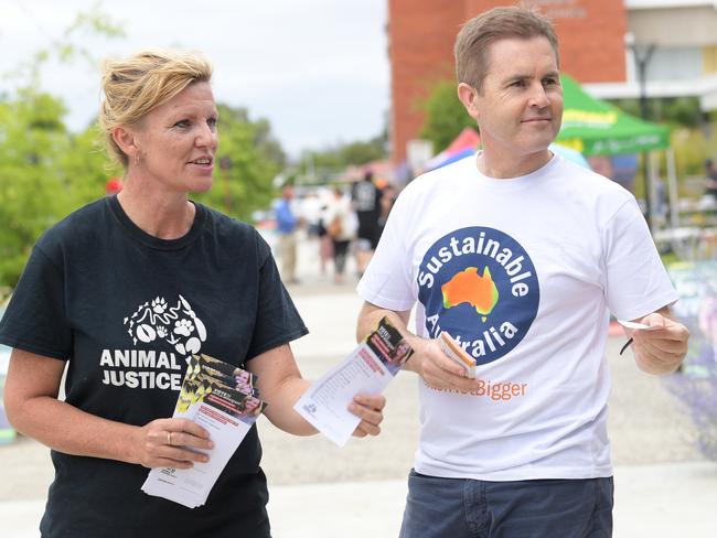 Animal Justice Party candidate Skyla Shane Wagstaff and Sustainable Australia candidate William Bourke approach voters at Tamworth High School polling booth.