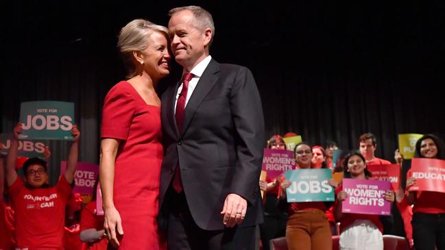 Mr Shorten with his wife Chloe during a Labor Party campaign rally at Box Hill Town Hall in Melbourne on Sunday. Picture: AAP/Darren England