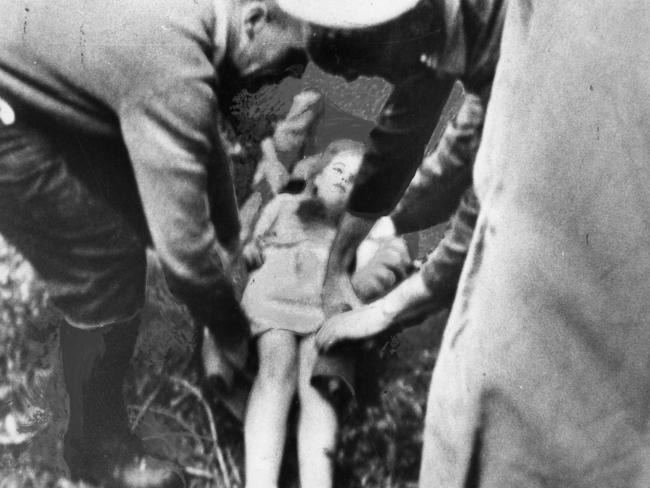 Wendy Pfeiffer (now Sheppard), 9, of Mylor, being tended by police and volunteers as she lay on the ground on a blanket soon after being found on October 25, 1966. Picture: The Advertiser