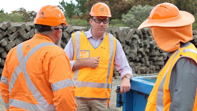 Minister Sam Farraway (centre) with repair workers on the shuttered Blue Mountains line as it prepares to reopen. Picture: Supplied