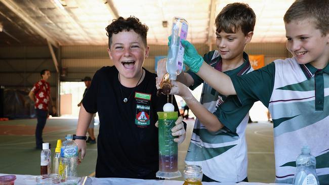 Whitfield State School has hosted its annual science day, learning practical applications for science and experiments. Grade 6 students Theo Candy, Koby Thornton and Christian Philp have some fun learning about the different viscosity and density of household liquids. Picture: Brendan Radke