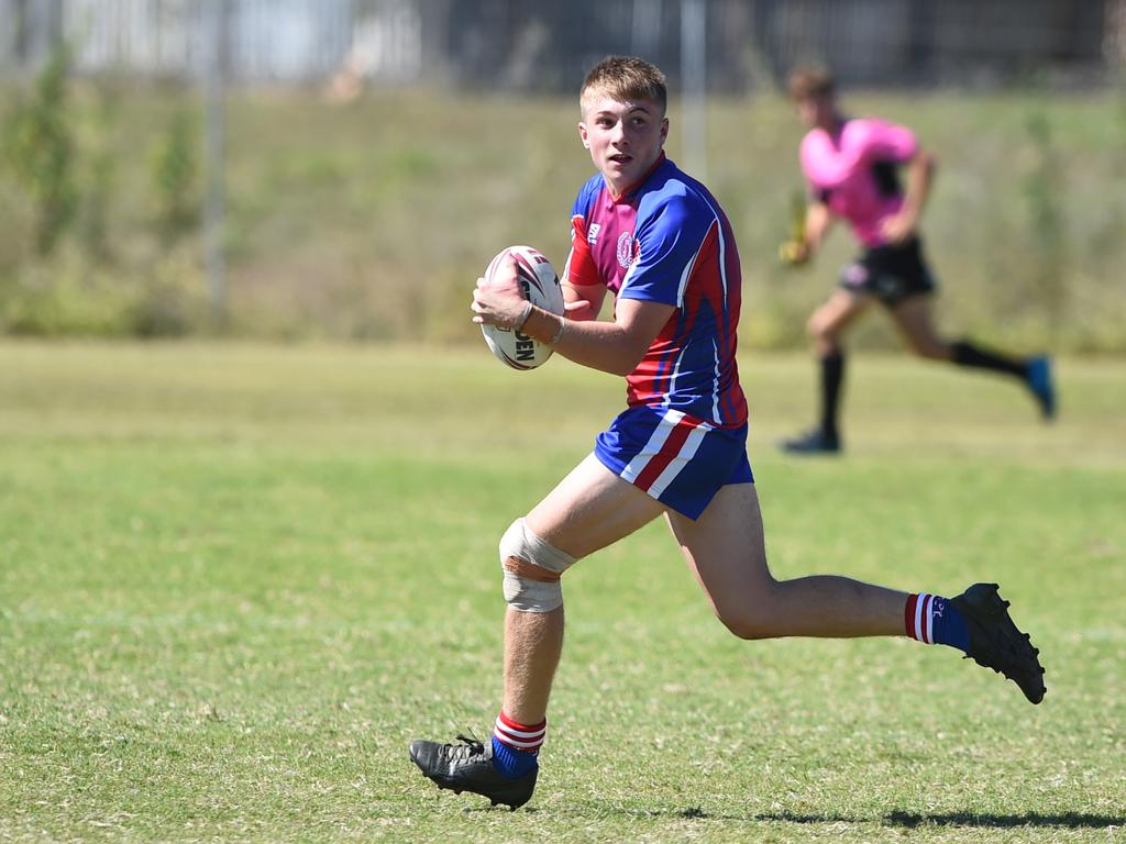 Boys Rugby League State Championship held at Northern Division, Brothers Leagues ground, Townsville. 16-18 years. Peninsula (stripe) v Darling Downs (blue/purple). Bodhi Sharpely of St Mary's College, Toowoomba.