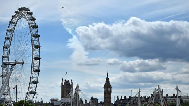 A plane flies over the Palace of Westminster. Picture: Ben Stansall/AFP