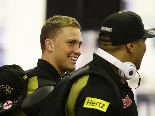 Matt Moylan checks in at Sydney Airport for Penrith's game in New Zealand. Pic Brett Costello