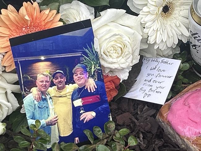 Flowers and pictures were left behind by family and friends of Jayme Sykes.