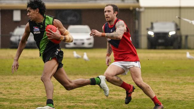 SFNL: Doveton’s Josiah Kyle is too quick for Tim O'Shannessy of Chelsea Heights. Picture: Valeriu Campan