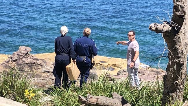 Forensic officers and a detective at the rock platform between Dalwood and Fairlight beaches, where a 26-year-old North Narrabeen man was allegedly assaulted and left with serious head and neck injuries. Picture: Jim O'Rourke