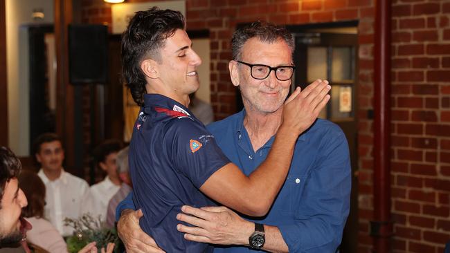 Nick Daicos gets a hug from dad Peter after being recruited by Collingwood. Picture: Mark Stewart