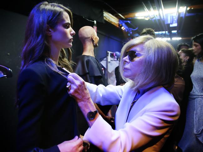 Zampatti puts the finishing touches to a model’s outfit at her 2017 Spring/Summer parade at the Sydney Theatre Company. Picture: John Feder