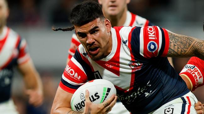 PERTH, AUSTRALIA - AUGUST 02: Terrell May of the Roosters attempts to break through the tacklers during the round 22 NRL match between Dolphins and Sydney Roosters at HBF Park, on August 02, 2024, in Perth, Australia. (Photo by James Worsfold/Getty Images)