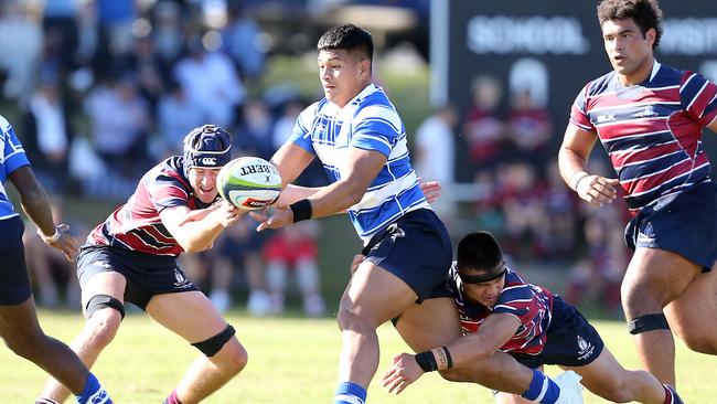 Titi Nofoagatotoa gets the offload away for Nudgee College. Picture: Richard Gosling