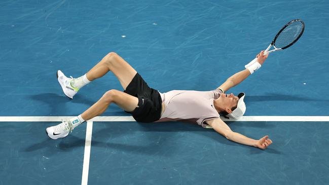 Jannik Sinner of Italy celebrates winning championship point.