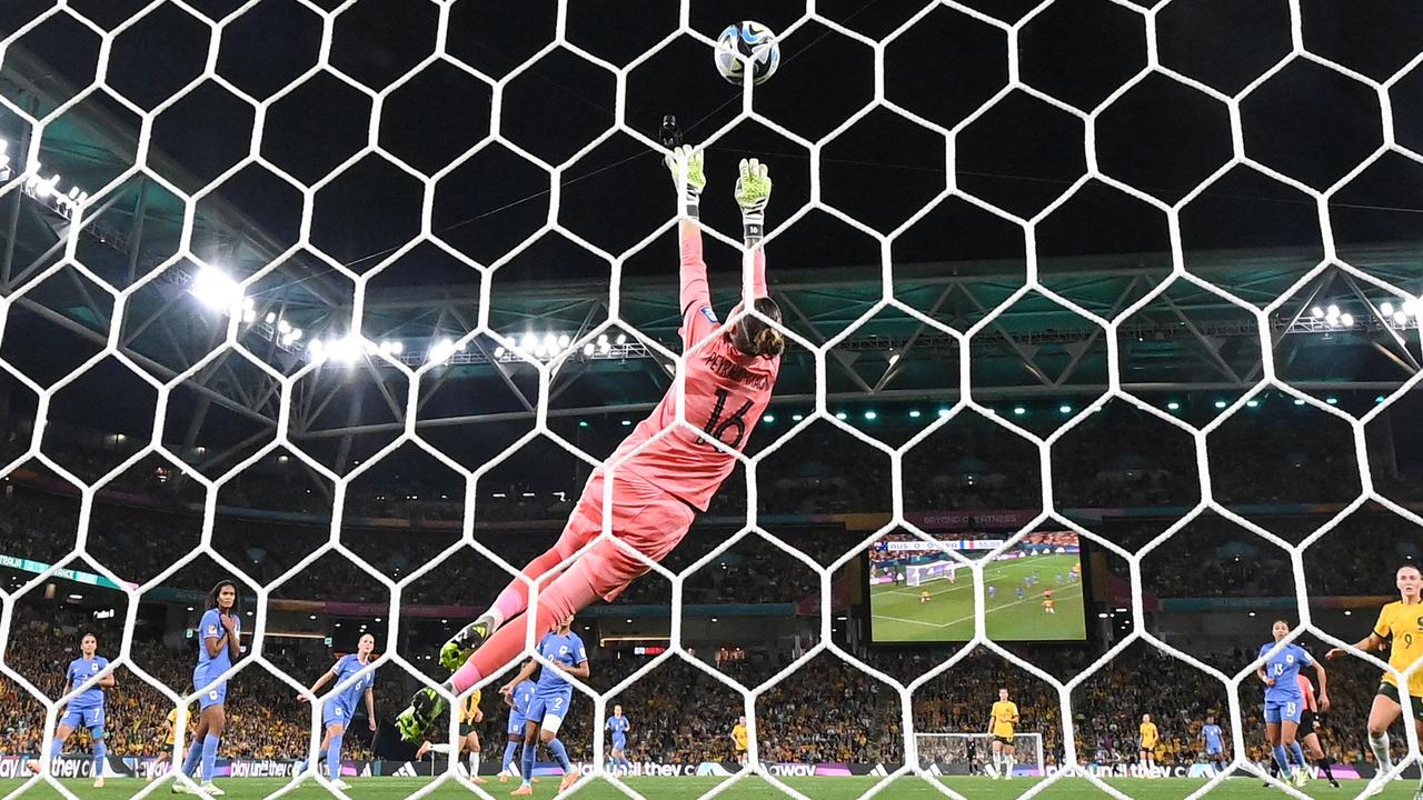 France's goalkeeper #16 Pauline Peyraud-Magnin (C) makes a save during the Australia