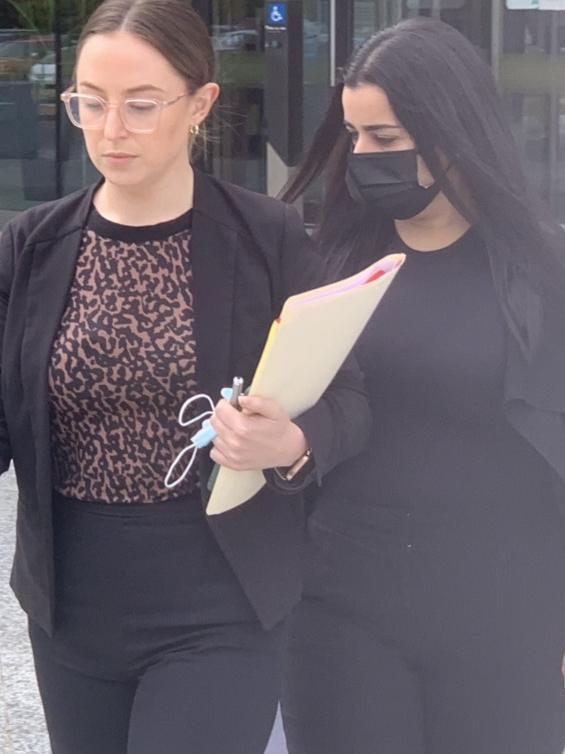 Petra Shasha (right) leaves the ACT Law Courts with her lawyer. Picture:Julia Kanapathippillai