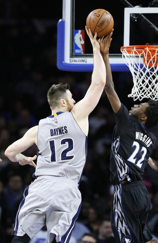 Minnesota Timberwolves’ Andrew Wiggins (22) blocks a shot attempted by Detroit Pistons’ Aron Baynes (12) during the second half of an NBA basketball game Thursday, Dec. 31, 2015, in Auburn Hills, Mich. The Pistons defeated the Timberwolves 115-90. (AP Photo/Duane Burleson)