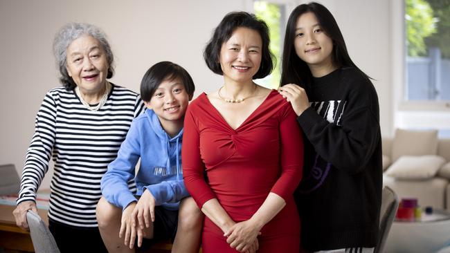 Journalist and The Australian’s Australian of the Year Cheng Lei at home in Melbourne with her mother, Hua, and her children Alex and Ava. Picture: Arsineh Houspian