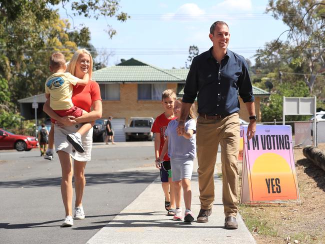 Treasurer Jim Chalmers arrives to vote with his wife Laura and children Jack 4, Annabel 6, and Leo 8 at Springwood Central State School. Picture: Adam Head