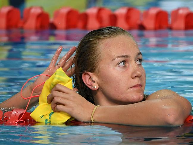 Ariarne Titmus of Australia looks on after swimming in the Women's 4 x 200m Freestyle Final on day three of swimming competition at the XXI Commonwealth Games at Gold Coast Aquatic Centre on the Gold Coast, Australia, Saturday, April 7, 2018. (AAP Image/Dave Hunt) NO ARCHIVING, EDITORIAL USE ONLY